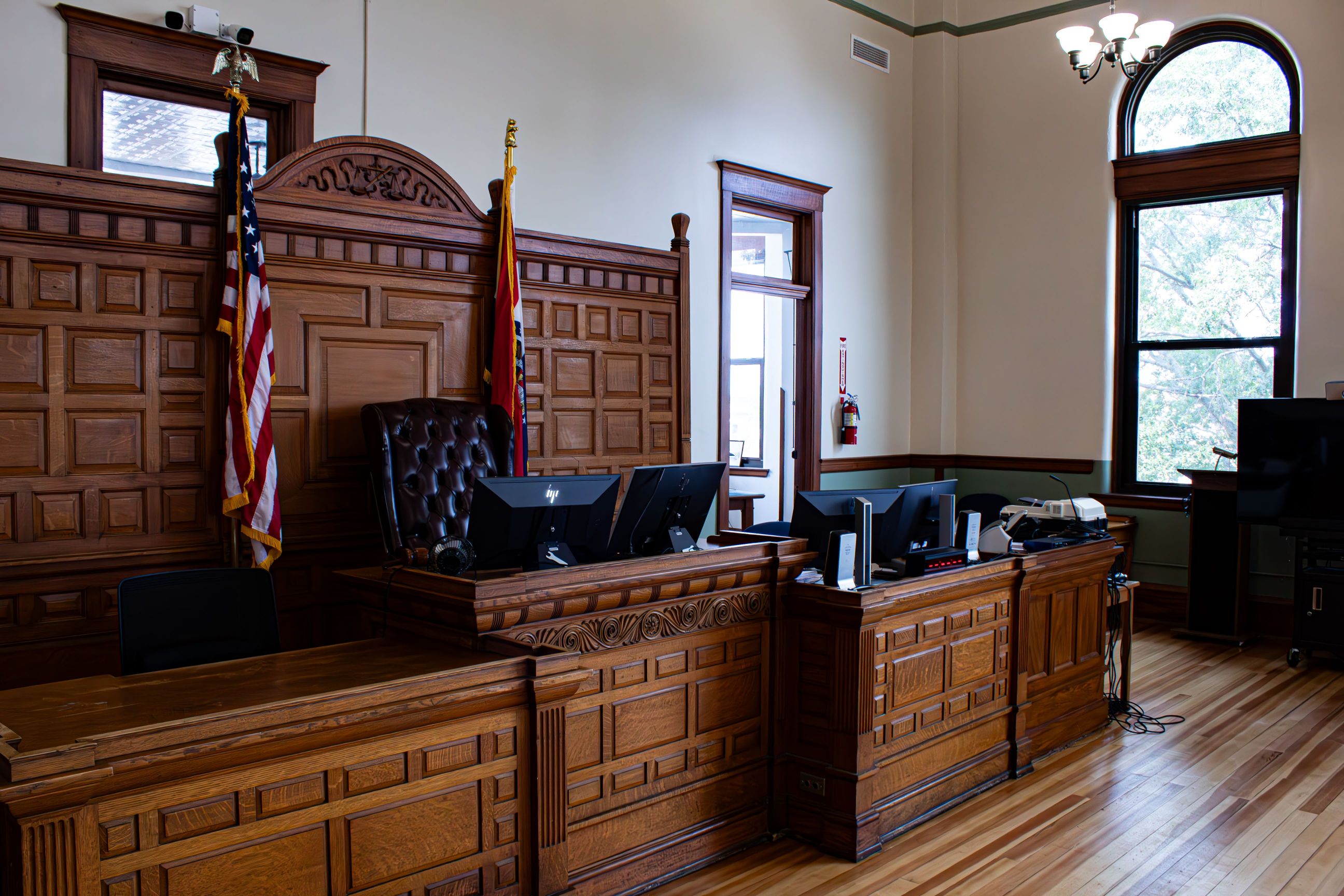 An empty judge's bench in an American courtroom